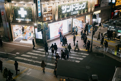 A crosswalk in shibuya as seen from above.
