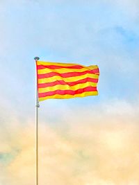 Low angle view of flag against sky