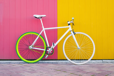 Bicycle parked against wall