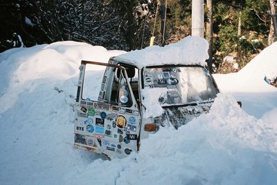 High angle view of cars on snow covered road