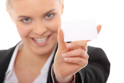Portrait of a smiling young woman holding hands