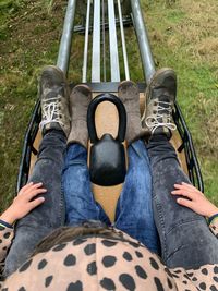 Low section of person sitting outdoors