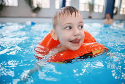 Boy swimming in pool