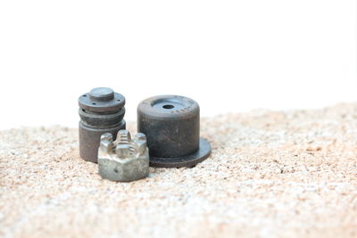 Close-up of sunglasses on beach