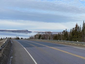 Empty road against sky