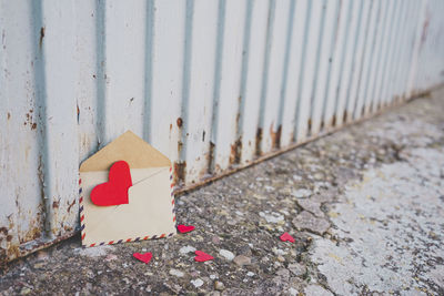 Close-up of heart shapes in envelope on street