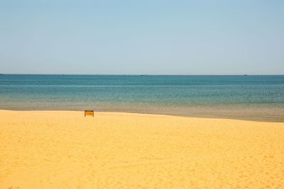 Scenic view of beach against clear sky