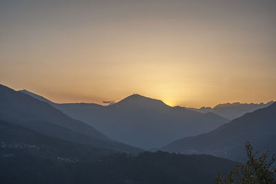 Scenic view of silhouette mountains against sky during sunset