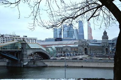 View of bridge and cityscape against sky