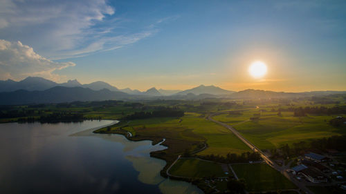 Scenic view of landscape against sky during sunset
