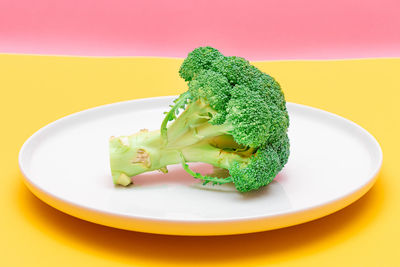 Close-up of lemon slice in plate on table