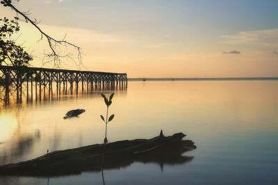 Scenic view of lake against sky during sunset