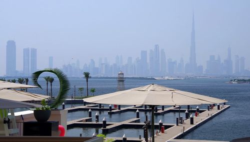 Modern buildings in city against clear sky