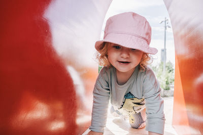 Close-up of smiling girl having fun in playground