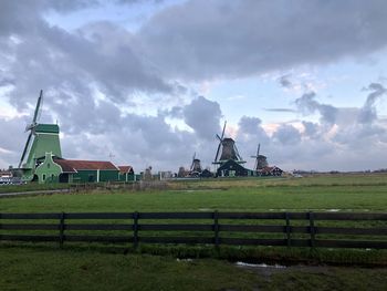 Built structure on field against sky