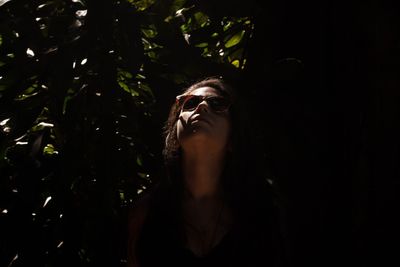 Close-up of young woman looking up