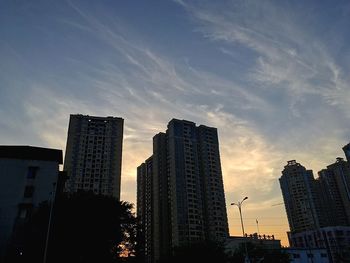 Low angle view of modern buildings against sky