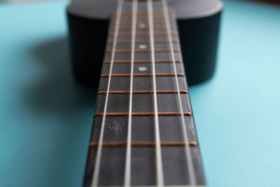 Close-up of guitar on table