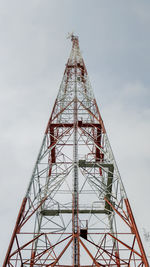 Low angle view of electricity pylon against sky