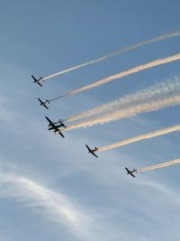 Low angle view of airplane flying against sky