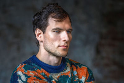 Portrait of young man looking away