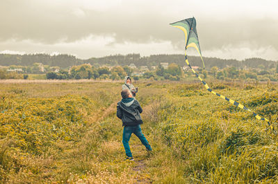 Man standing on land against sky