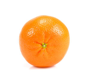 Close-up of orange apple against white background