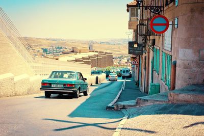 Cars on road against sky