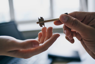 Close-up of people holding hands