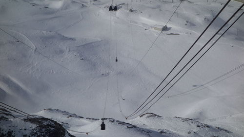 High angle view of snow covered mountain against sky