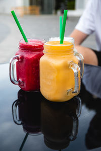 Midsection of woman holding drink