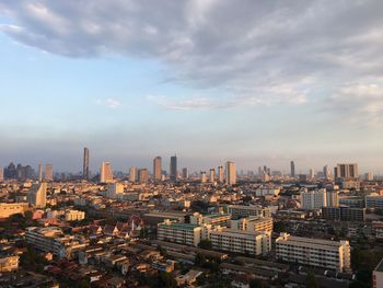 Aerial view of modern buildings in city against sky