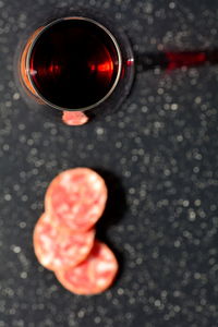 High angle view of red drink on table