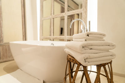 Low section of woman washing hands in bathroom