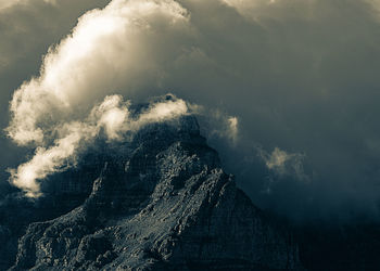 Low angle view of rock formation against sky