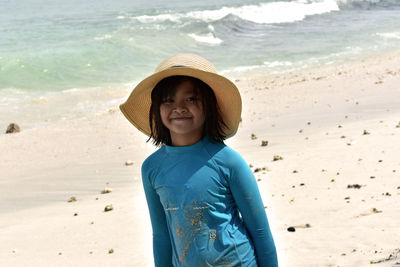 Portrait of smiling girl standing on beach