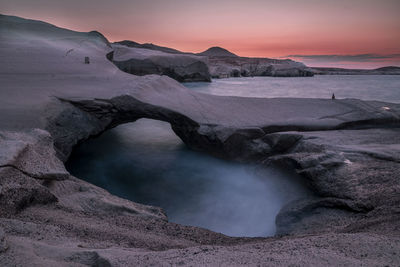 Scenic view of lunar landscape against sky during sunset