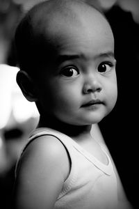 Close-up of cute boy black and white