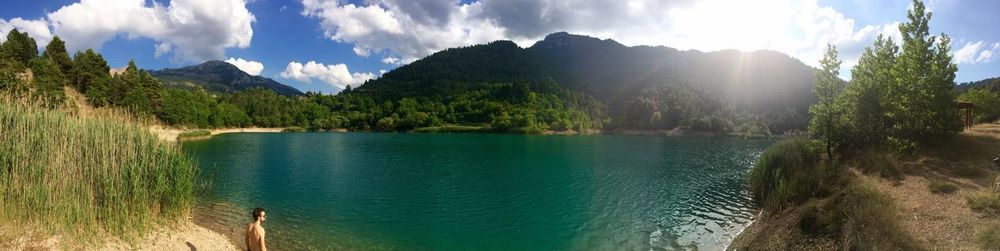 Panoramic view of lake against cloudy sky