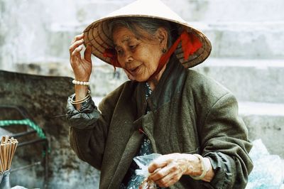 Portrait of woman holding man outdoors