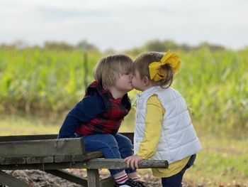 Rear view of father and son on land