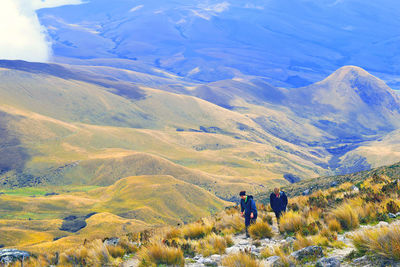 Tourists on mountain landscape
