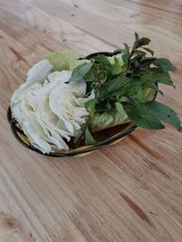 High angle view of leaves in container on table