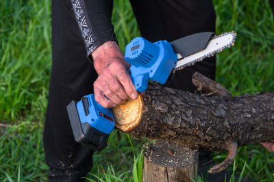 Low section of man working on field