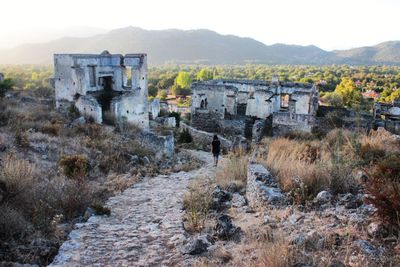 Old building on mountain against sky