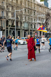 People walking on road in city