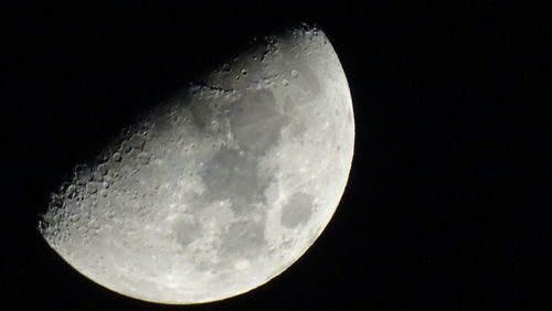 Low angle view of moon against clear sky at night