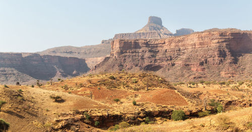 Scenic view of rocky mountains against clear sky