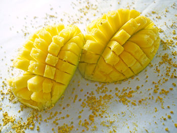 High angle view of yellow slices on table