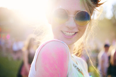 Close-up portrait of happy beautiful woman at carnival